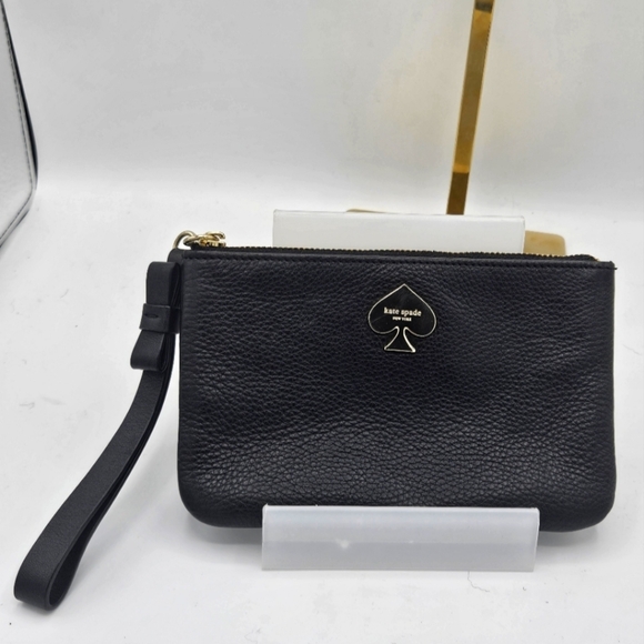 kate spade Handbags - Authentic Kate Spade black wristlet with bow detail on strap